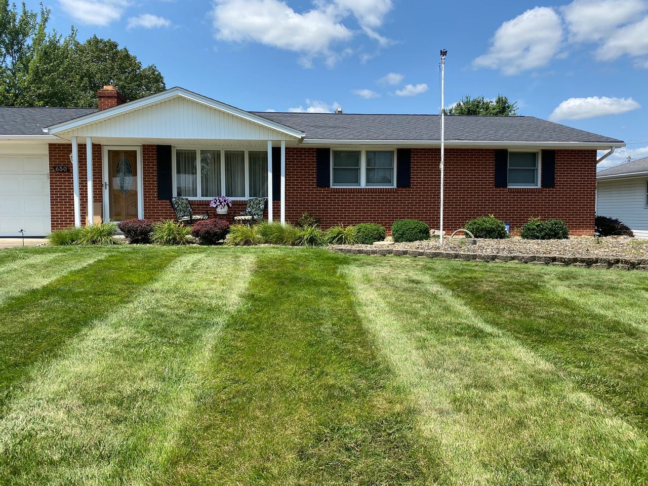 Freshly maintained front lawn and landscaping